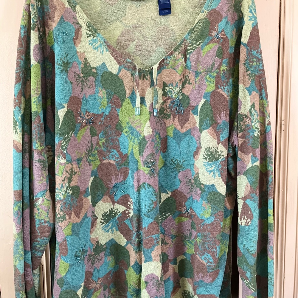 Beautiful sweater with a fresh mix of cool greens & blues on a neutral ground.